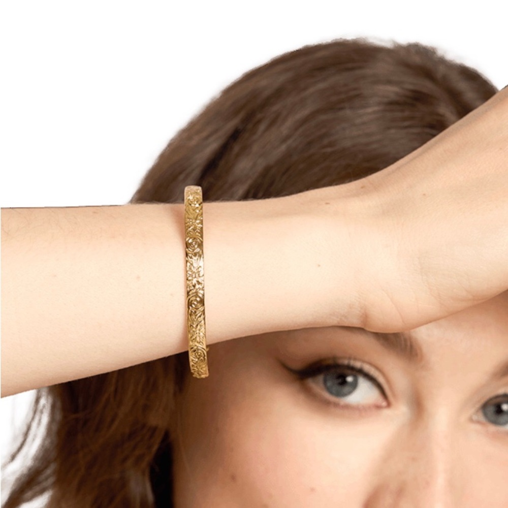 Our spare change 148k gold plated floral cuff bracelet